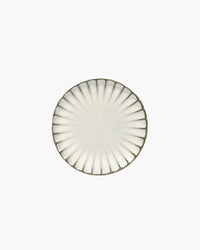 Top view of the white Inku breakfast plate by Serax showing the reactive glaze