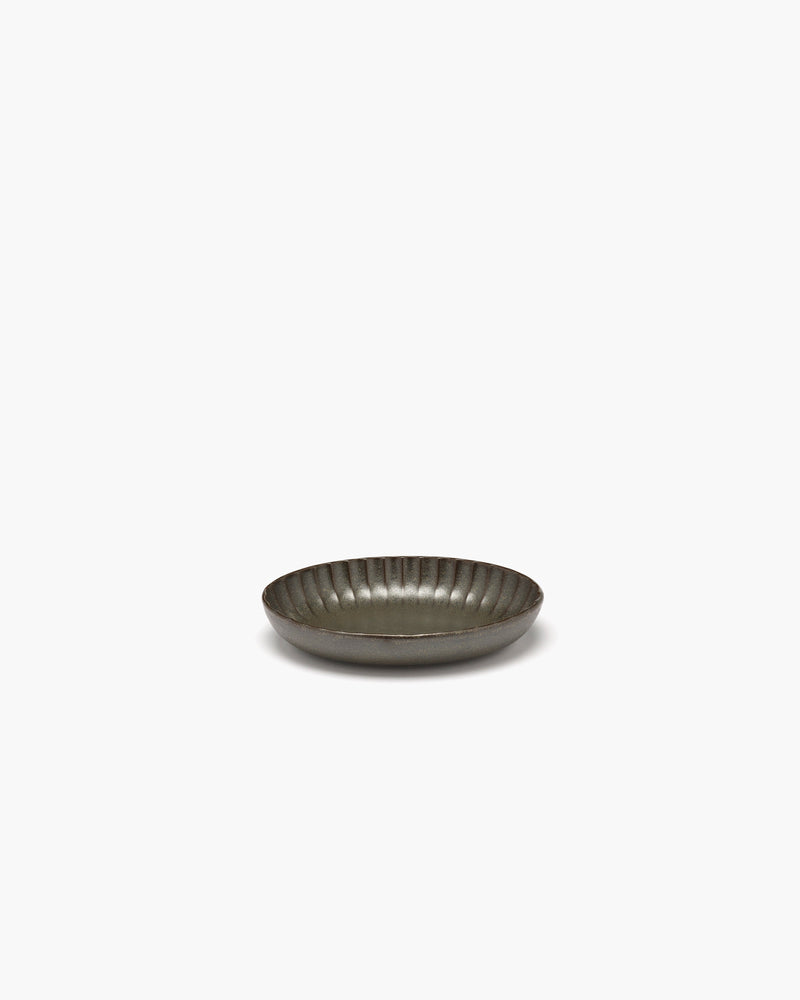 Small green Inku oval serving bowl by Sergio Herman for Serax on a white background