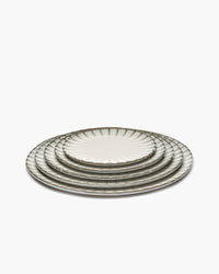 Stack of white Inku plates by Sergio Herman for Serax