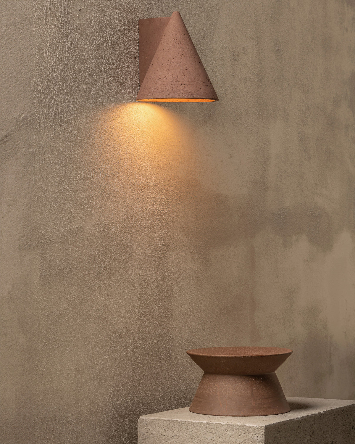 Serax Marie-Ann Vase 01 styled on a plinth beneath a wall light