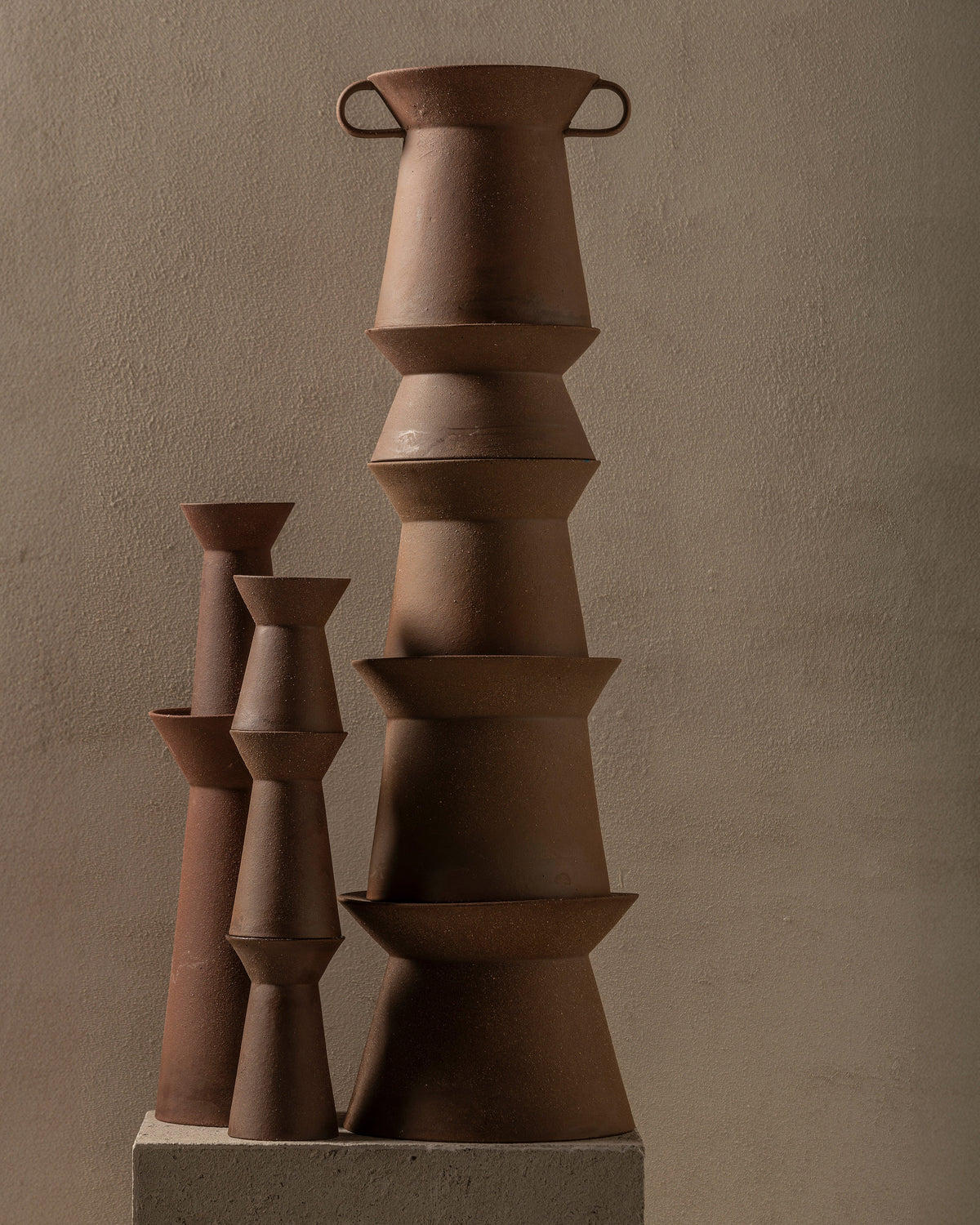 Marie-Ann vases and candle holders by Serax stacked in a tonal group