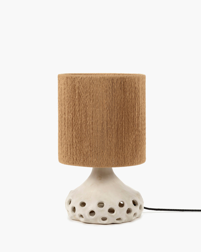 Oya stoneware table lamp by Sophie Casier for Serax with beige perforated base and brown shade