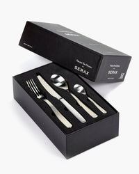 Serax Passe-partout 24-piece cutlery set laid out in its open black gift box