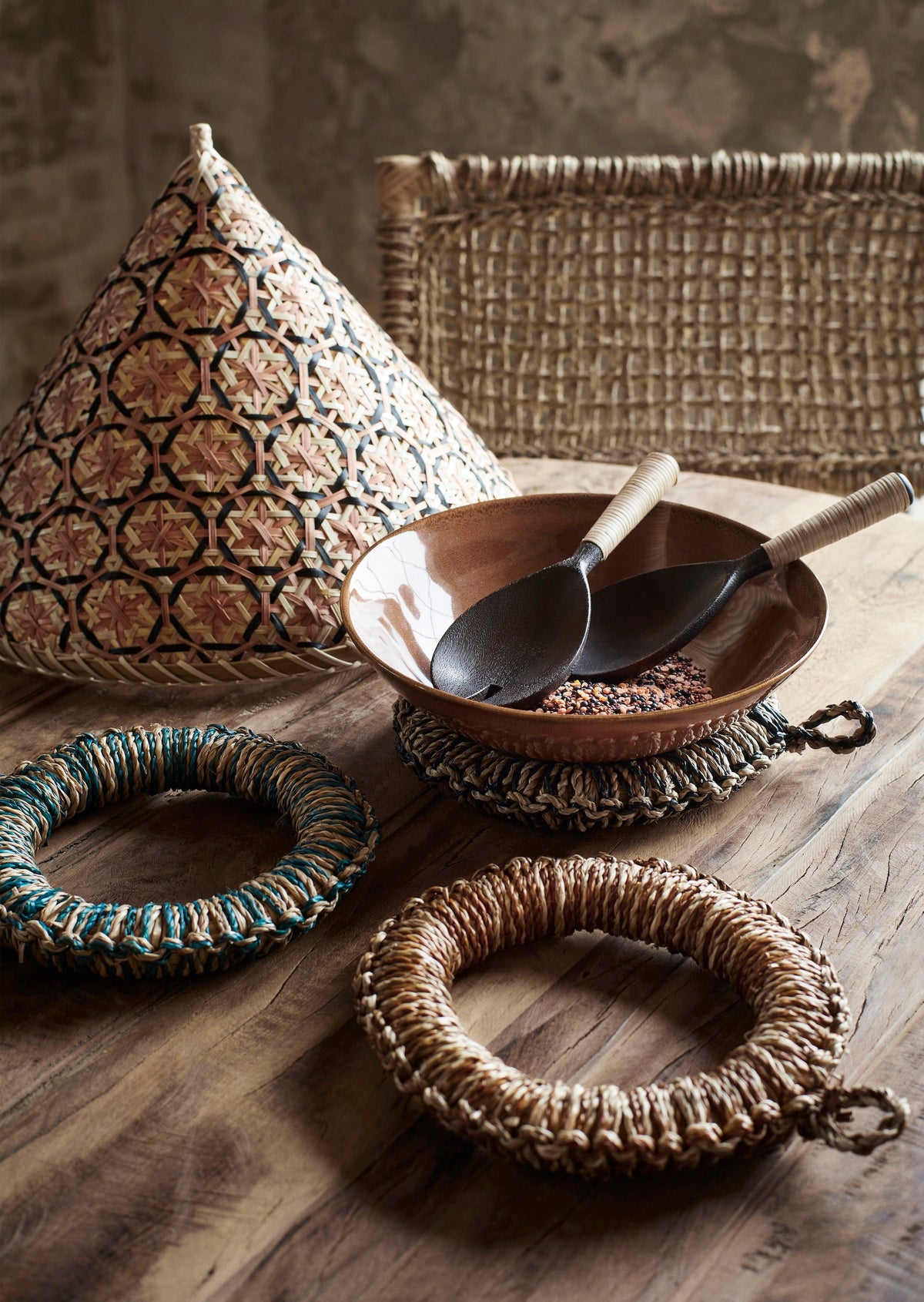 wooden serving set with bamboo handles styled in a ceramic bowl on a rustic wooden table