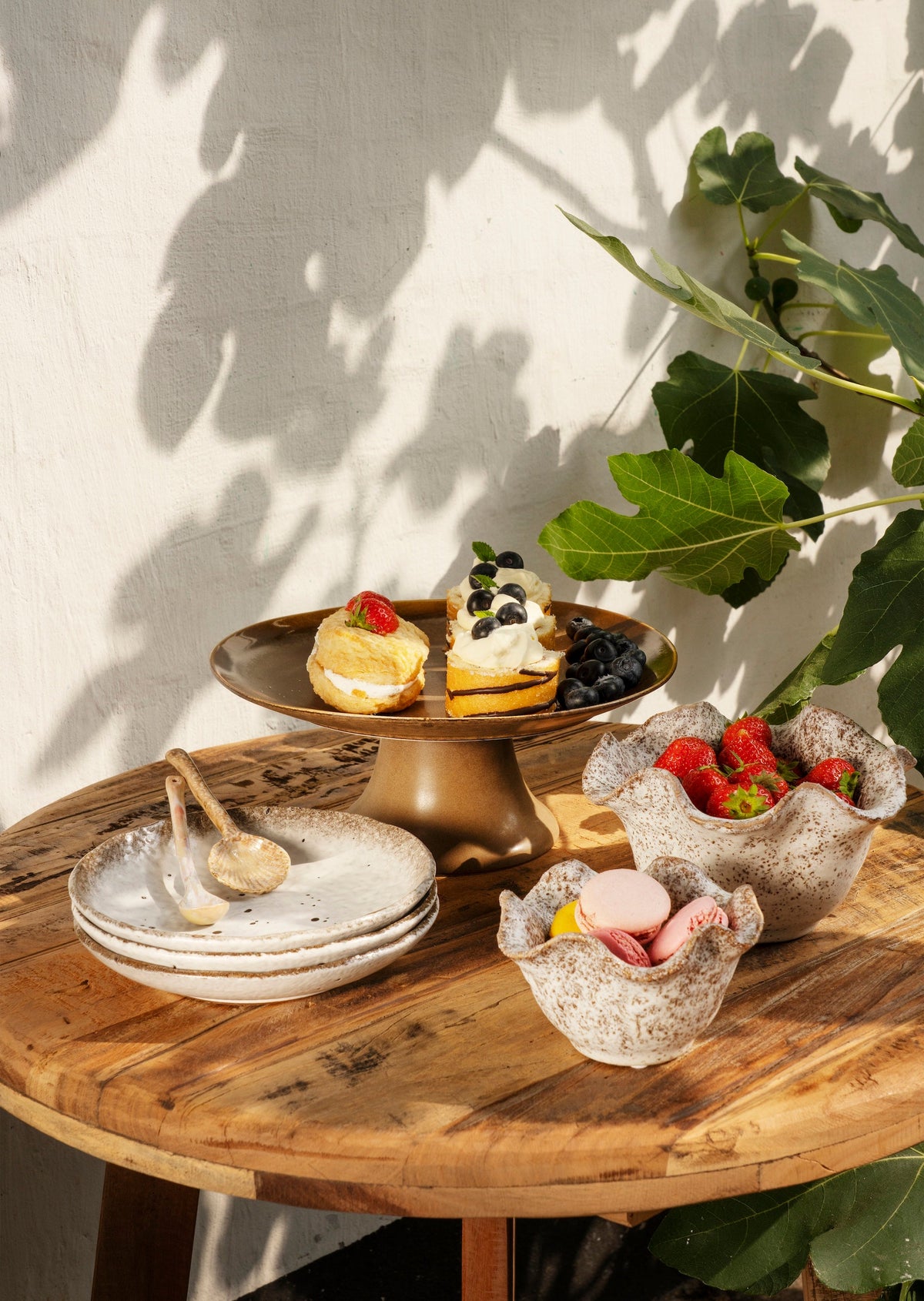 beige and brown matching speckled stoneware plates and bowls styled together
