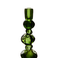 Close-up of stacked glass detail on large emerald candle holder