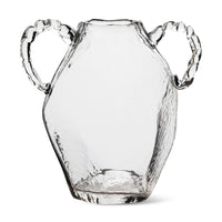 Clear glass amphora hkliving vase with twisted handles on white background