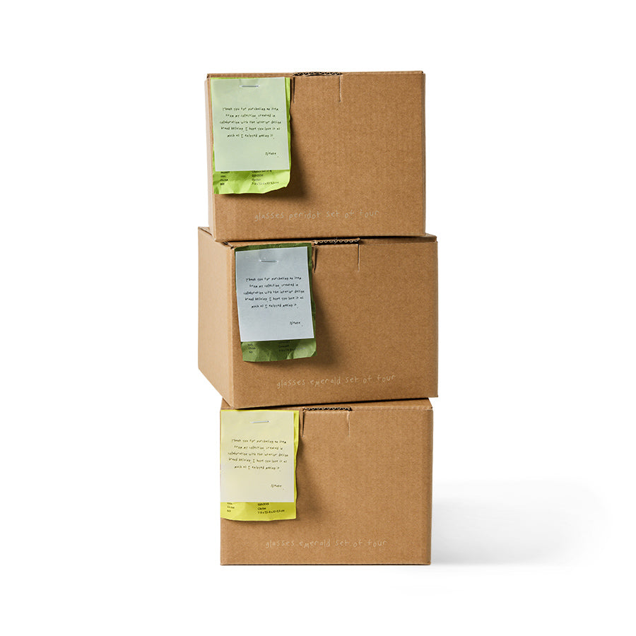 Nienke Sikkema for HKLIVING emerald glasses sets stacked in branded gift boxes on white background