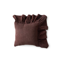 Front view of chestnut brown cotton ruffle cushion on white background