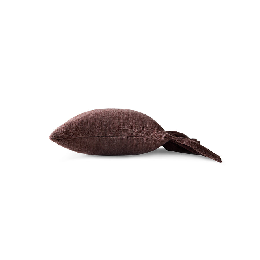 Side profile of chestnut brown ruffle cushion showing depth and ruffled edge