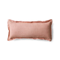 Dusty peach linen cushion on white background