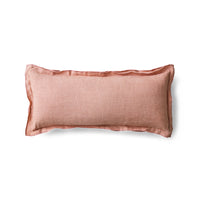 Front view of dusty peach linen cushion on white background