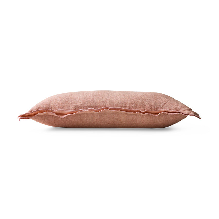 Side profile of dusty peach linen cushion showing flanged edge