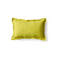 Lemongrass yellow linen cushion on white background