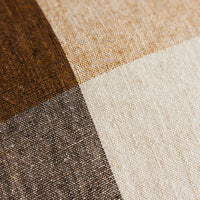 Close-up of fabrics of the HKLIVING cushion in brown, beige, and gray.