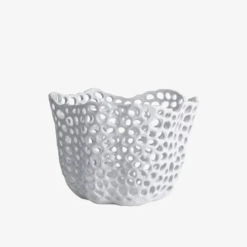 the decorative bowl by itself in a white room... or maybe it's just sat in the infinate void