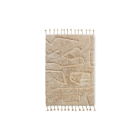 HKLIVING wool rug limitless in cream, flat lay on white background showing the tasselled ends and subtle woven pattern