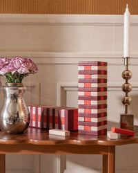Tumbling Tower displayed with flowers and decor