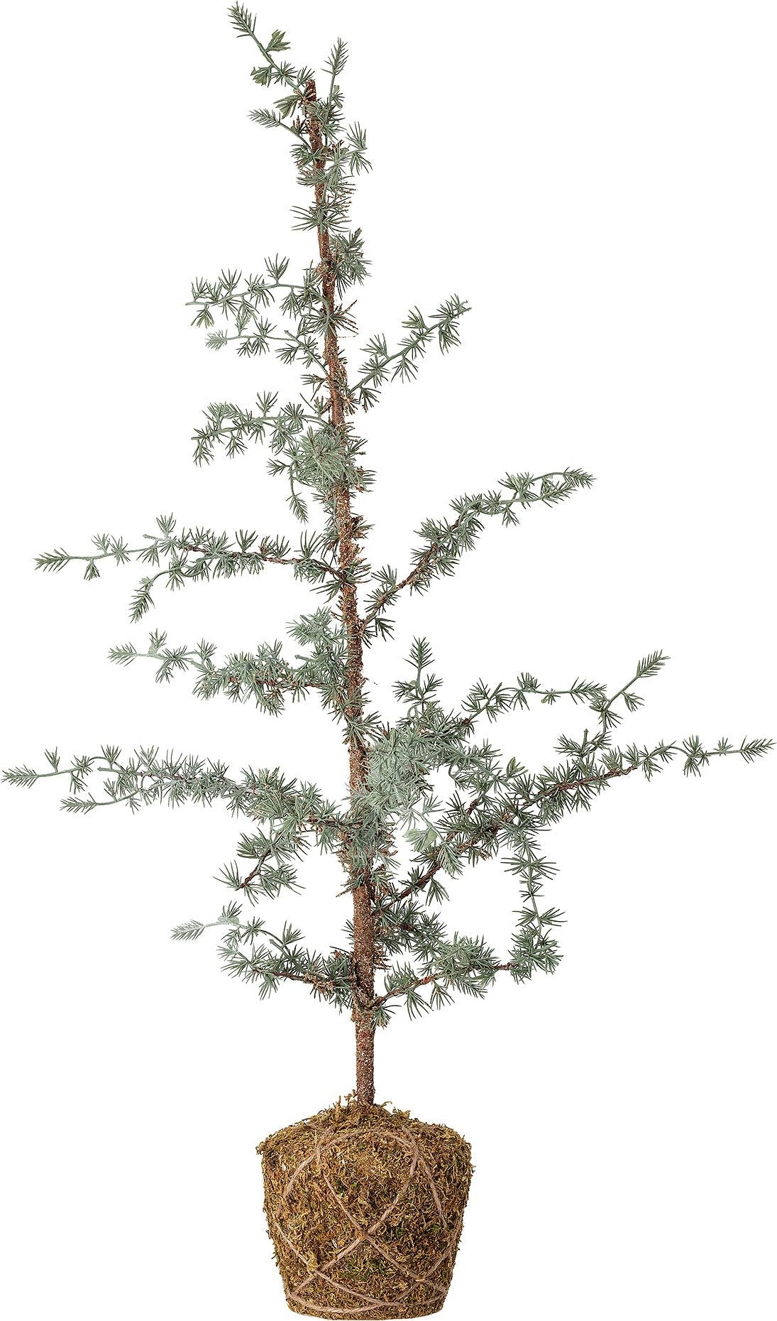 Close-up of artificial pine tree with moss-wrapped base