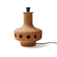 Brown ceramic lamp with black base on a white background