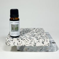 Woodland Essential Oil Blend by Ash + Ember in 10ml amber glass bottle with pine and cedar scent