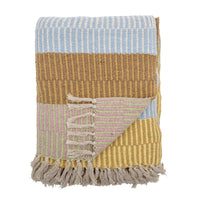 Folded Isnel throw showing pattern and texture