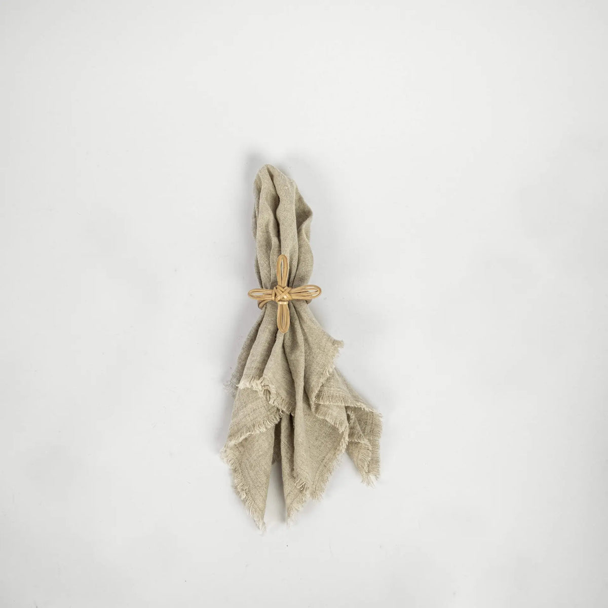 Zara bamboo flower napkin ring on a linen napkin by Olsson & Jensen