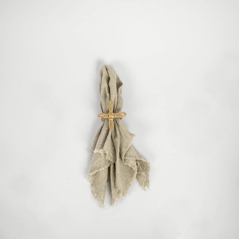 Zara bamboo flower napkin ring on a linen napkin by Olsson & Jensen